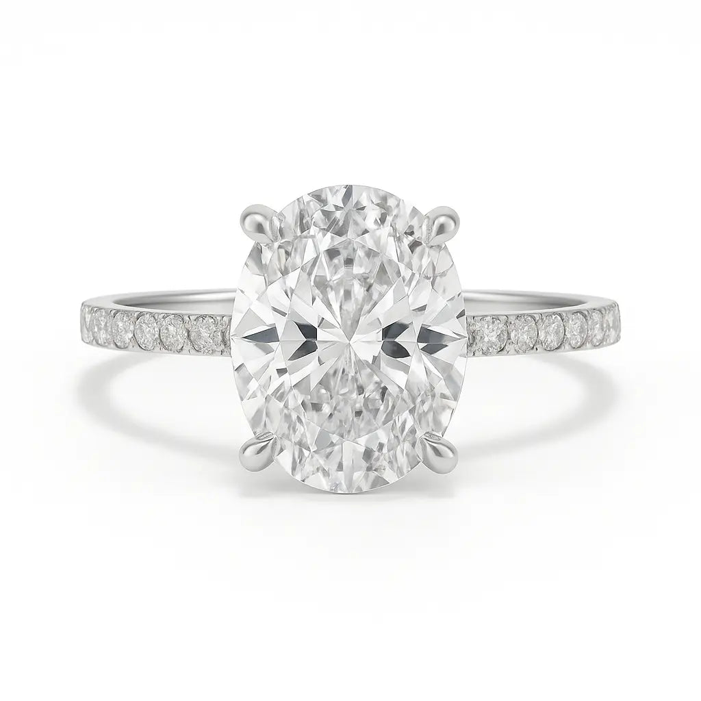 Diamond ring with a large central gemstone and smaller stones on the band against a white background