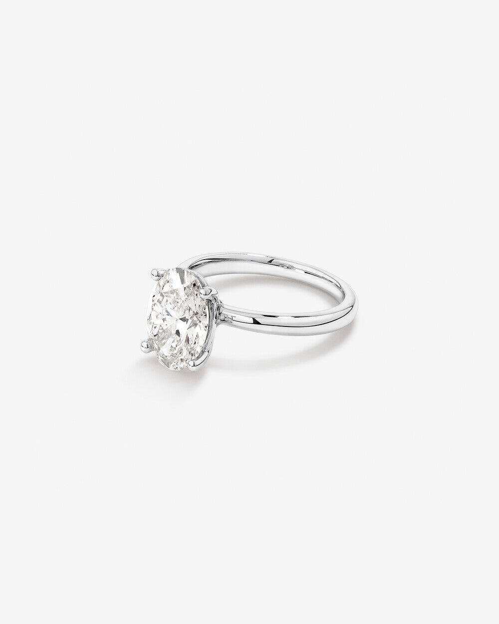 3 carat diamond ring on a white background side view