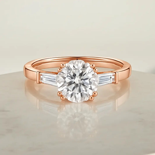 Rose gold ring with a diamond on a reflective surface