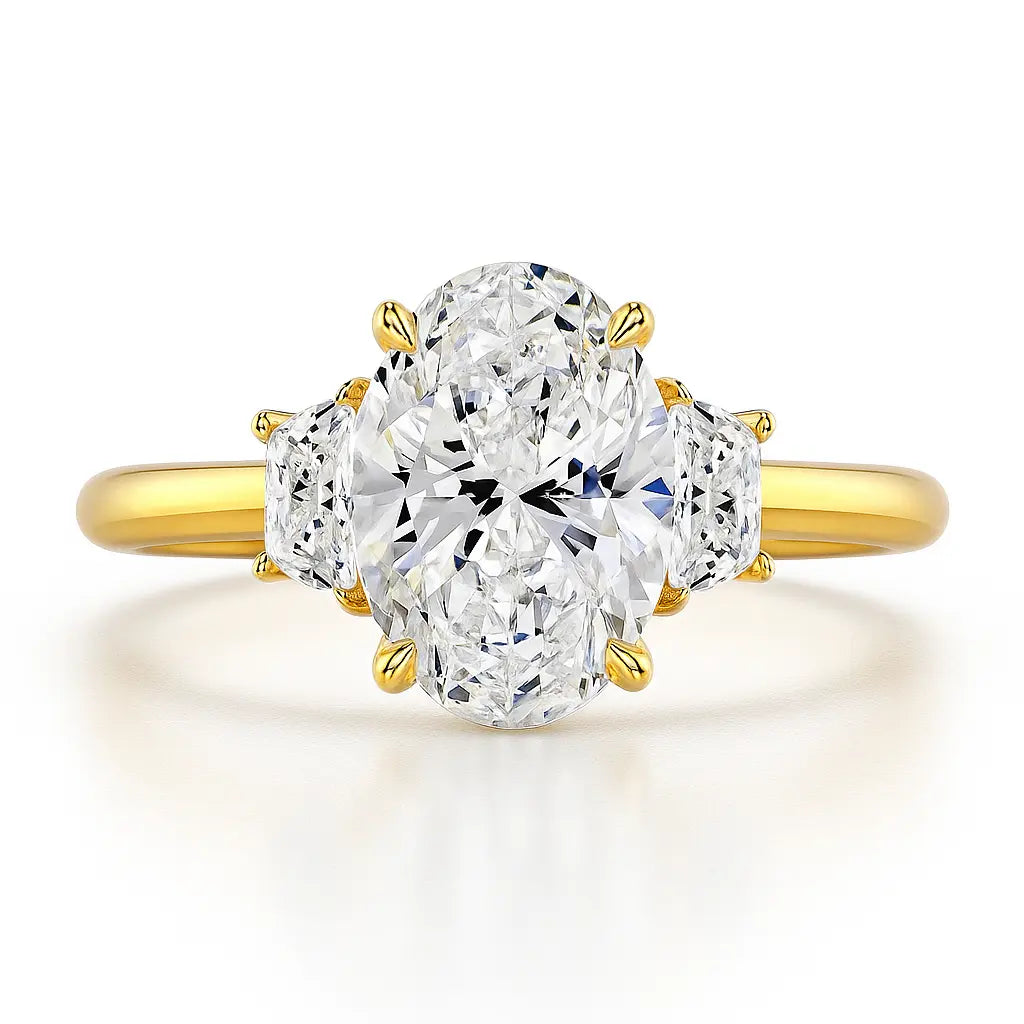 Gold ring with three oval-shaped diamonds on a white background