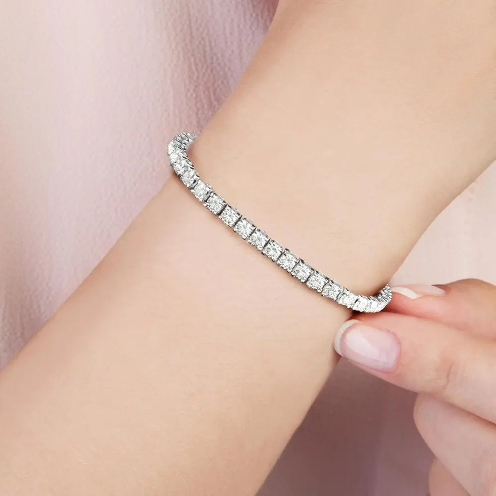 Lab diamond tennis bracelet worn on the wrist, 14K white gold
