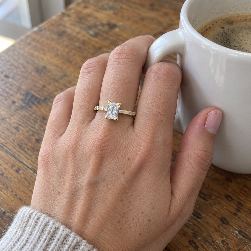 3 Carat Emerald Cut Lab Grown Diamond Engagement Ring worn on hand in 14K Yellow Gold - Future Jewelry