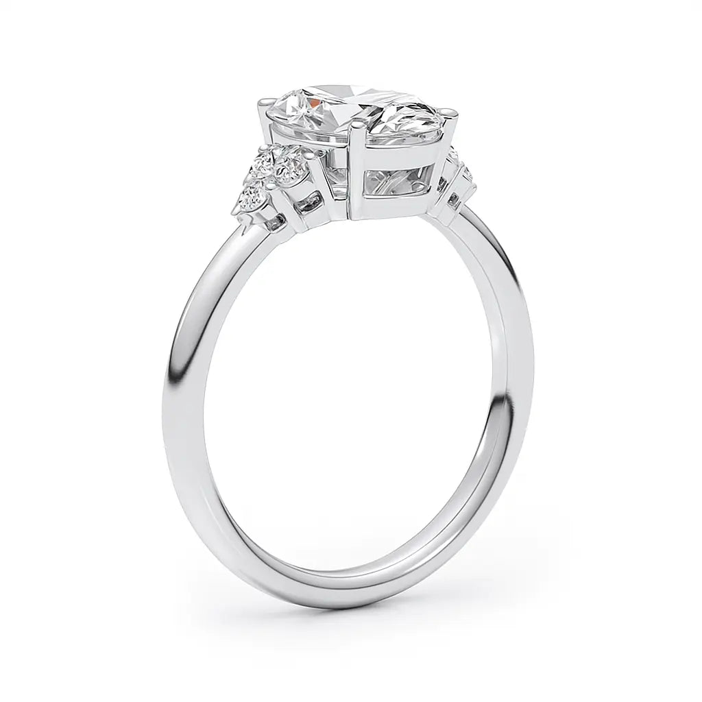 Diamond ring with three clear gemstones on a white background