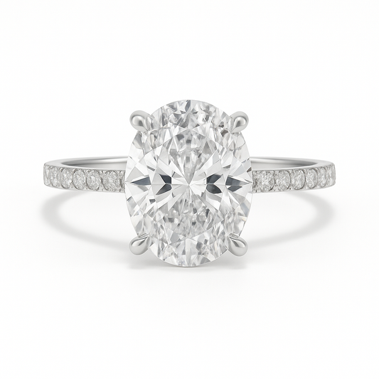 Diamond ring with a large central gemstone and smaller stones on the band against a white background