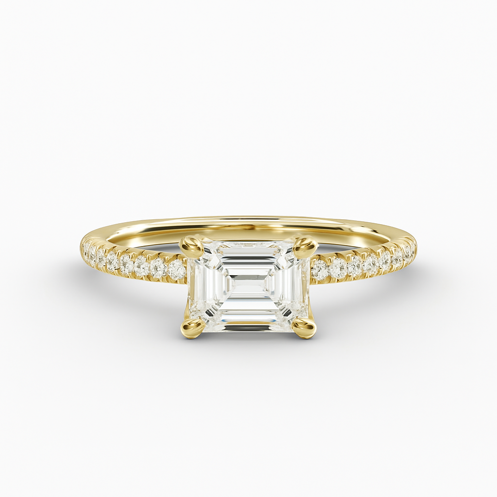 Gold ring with a large diamond and smaller diamonds on the band against a white background