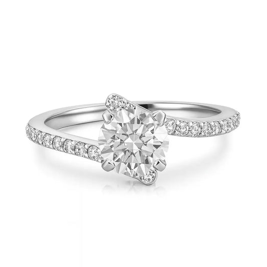 Diamond ring with a white gemstone and diamond-studded band on a white background