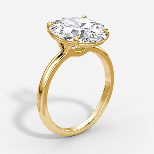 Gold ring with a large diamond on a white background