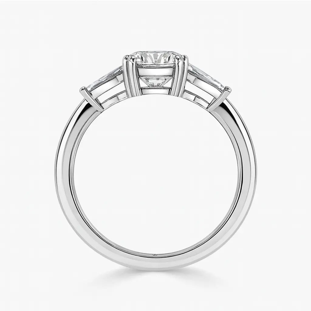 Diamond ring with a rectangular center stone on a white background
