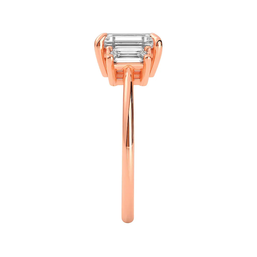 Rose gold ring with emerald-cut diamond on a white background