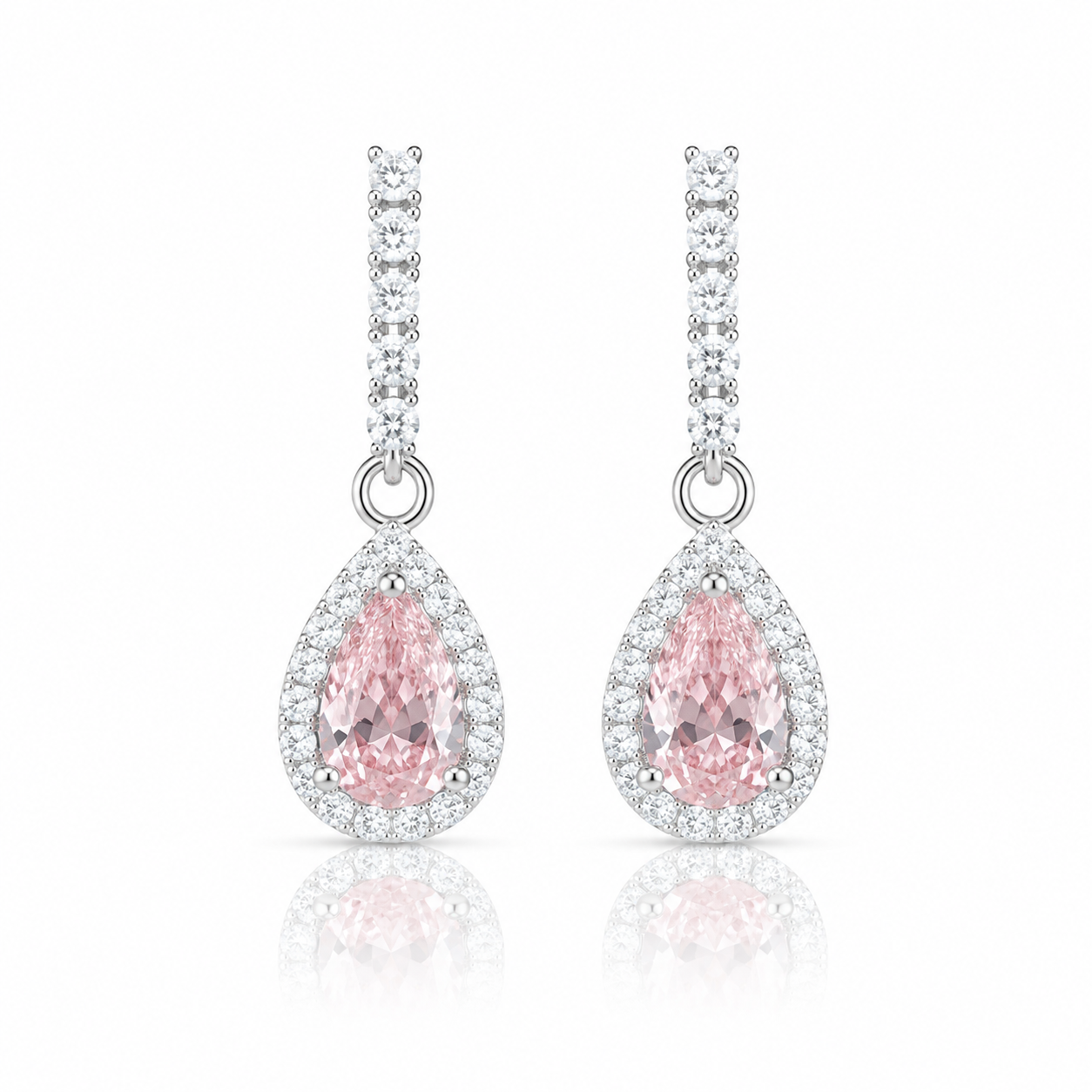 Teardrop-shaped pink gemstone earrings with silver accents on a white background