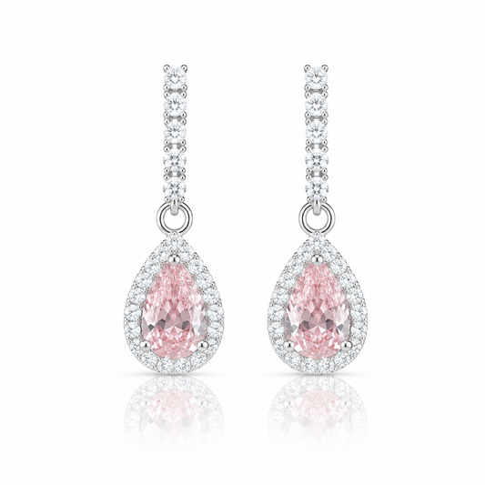 Teardrop-shaped pink gemstone earrings with silver accents on a white background