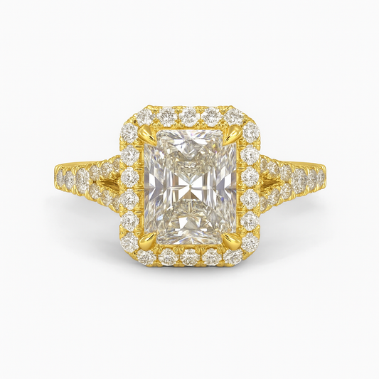 Gold ring with a large diamond and smaller diamonds on the band against a white background