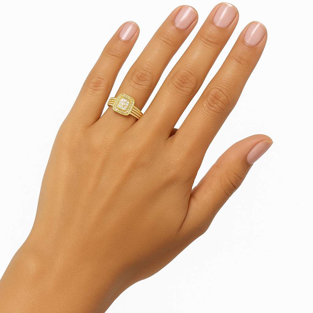 Gold ring on a hand with a plain background