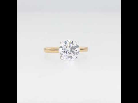 Gold ring with a large diamond on a white background video